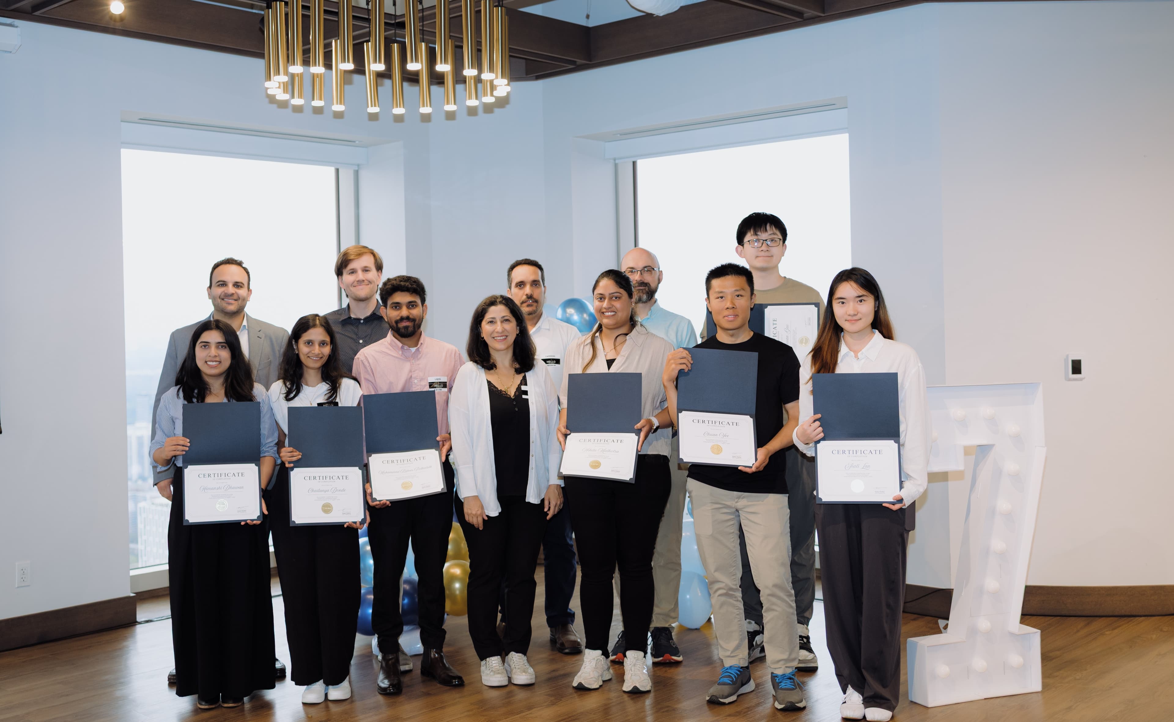 Past Industrial EIS Fundamentals workshop graduates holding their certificates of completion